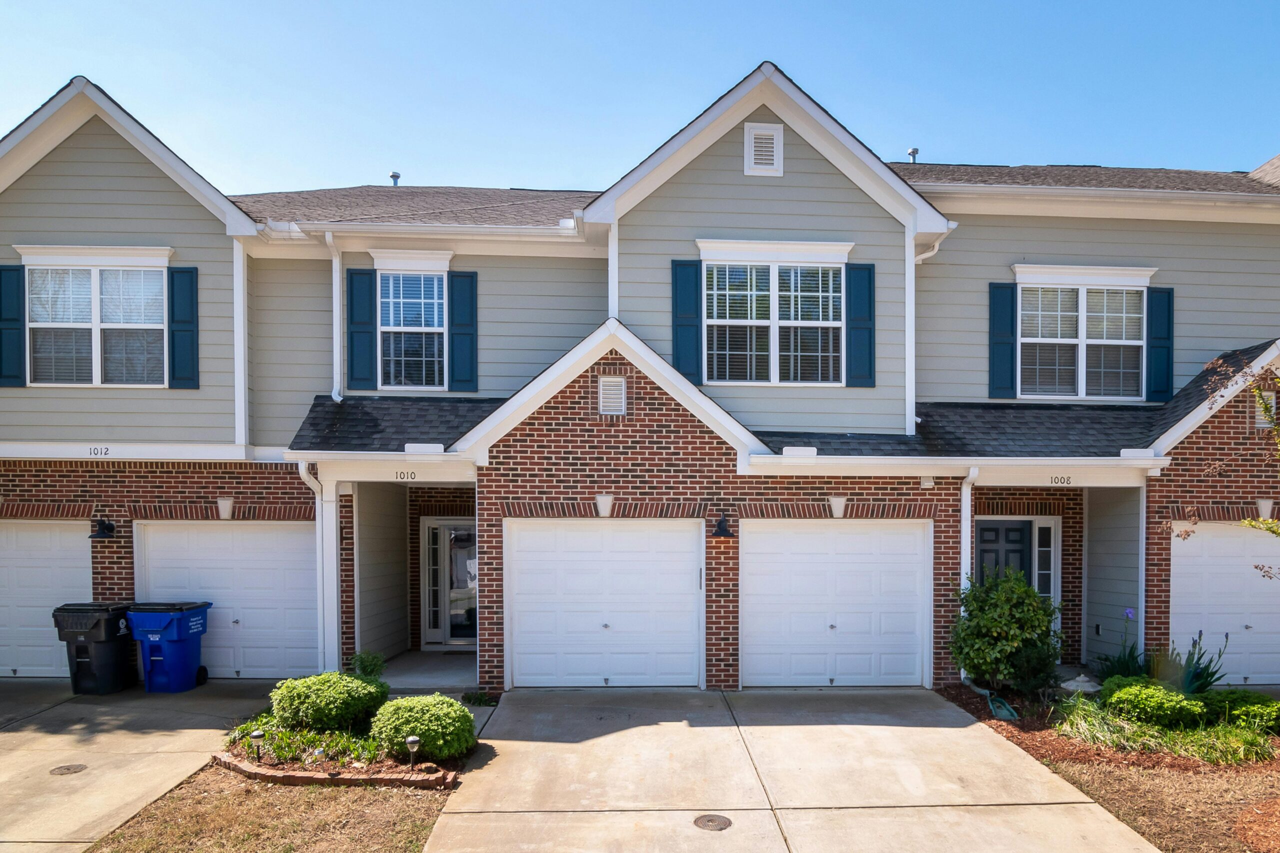 Brick townhome community with gutters